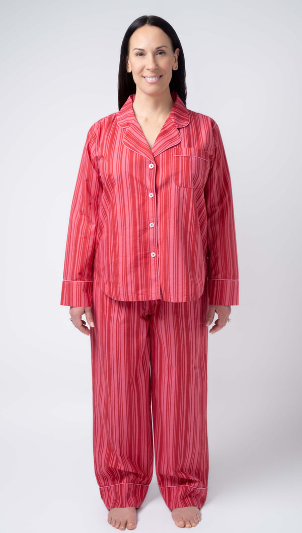 Woman wearing red striped pajamas on a white background